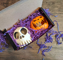 Load image into Gallery viewer, Whimsy Bear Designs Haunted Mansion Holiday ornament set packaging with pumpkin and skull